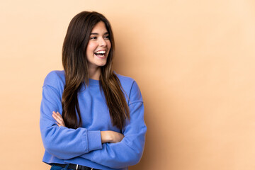 Teenager Brazilian girl over isolated background happy and smiling