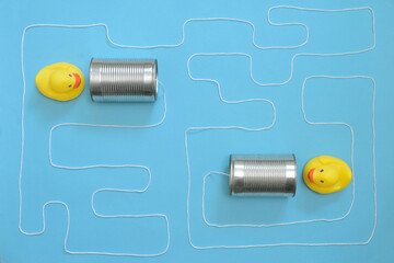 Communication Tin Can Phone With String and Yellow Toy Ducks