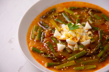 Green asparagus and vegetable soup. Traditional tapa from southern Spain.