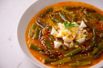 Green asparagus and vegetable soup. Traditional tapa from southern Spain.