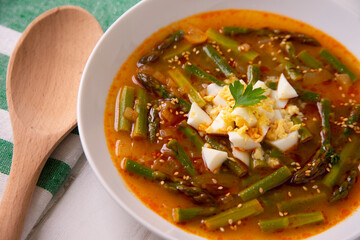 Green asparagus and vegetable soup. Traditional tapa from southern Spain.