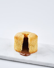 Molten Chocolate Fondant Nougat coulant with filling liquid chocolate. Typical spanish cake on a...