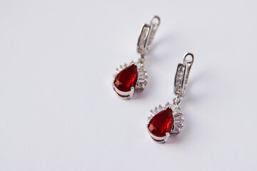 Ruby diamond earrings on white background