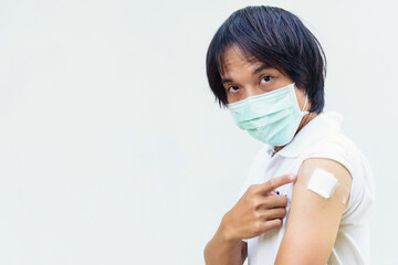 asian man wear mask and get vaccinated of covid-19