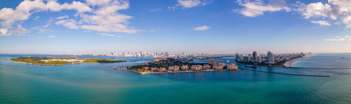 Majestic aerial panorama Miami Beach view of Fisher Island inlet and south beach