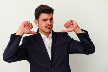 Young business caucasian man wearing wireless headphones isolated on white background feels proud and self confident, example to follow.