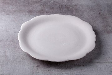 Empty blank white ceramic dish on Cement Board