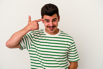 Fototapeta premium Young caucasian man isolated on white background showing a disappointment gesture with forefinger.