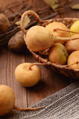 Basket with fresh organic yellow turnips
