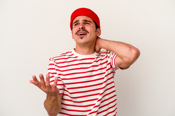 Young caucasian man isolated on white background screaming with rage.