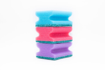 Pink ,blue and 
purple sponges for washing dishes isolated