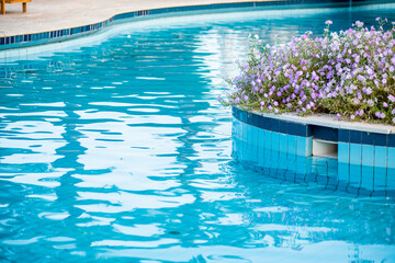 Fototapeta na wymiar Swimming pool and relax area on the tropical resort