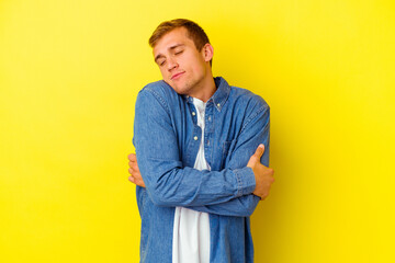 Young caucasian man isolated on yellow background