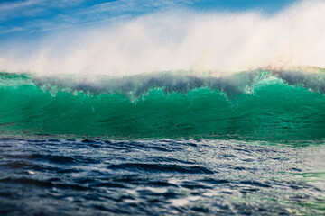 Ideal breaking sea wave with water drops