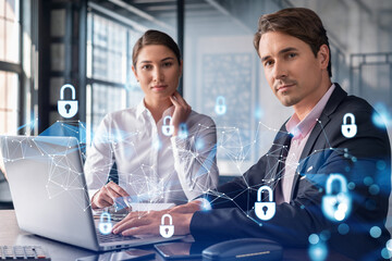 Businessman and businesswoman working together to protect clients confidential information and...