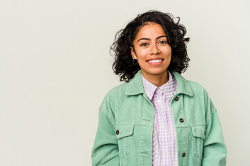 Young curly latin woman isolated on white background happy, smiling and cheerful.