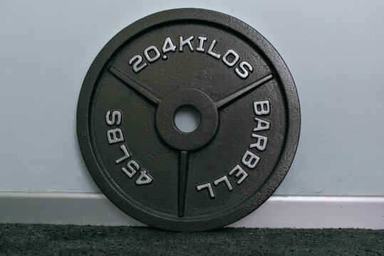 Black barbell olympic weight plate