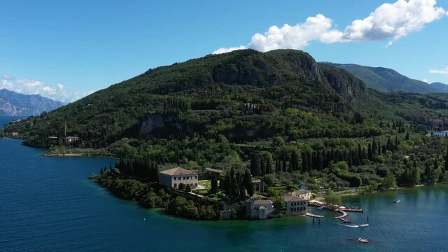 Aerial view of Parco Baia delle Sirene, Lake Garda, Italy. Top view of baia delle sirene on the coastline of Lake Garda. Baia delle Sirene on the coastline. Panorama of punta san vigilio. 	