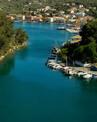 Fototapeta na wymiar Yachts and boats in paxos harbour on the ionian greek island holiday resort.