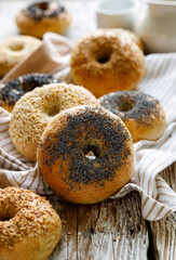 Homemade bagels with the addition of various seeds, focus on the bagel inside with poppy seeds, close up view