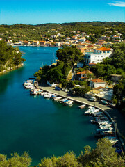 Fototapeta na wymiar Yachts and boats in paxos harbour on the ionian greek island holiday resort.