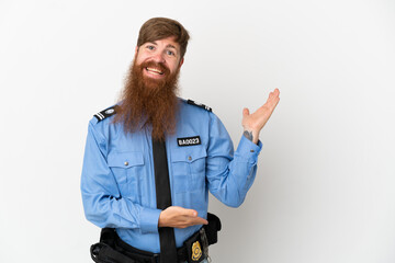Redhead police man isolated on white background extending hands to the side for inviting to come