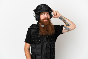 Redhead SWAT isolated on white background having doubts and with confuse face expression