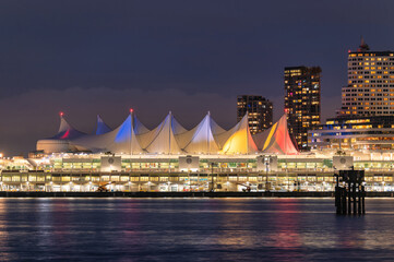 Night market building and skyscraper glowing on coastline in downtown at Stanley Park, Vancouver