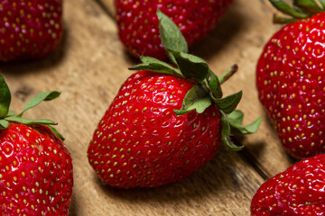 Strawberries on a wooden table. Ripe fresh strawberries. Healthy diet.