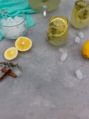 Lemon drink with lemon slices on a wooden background
