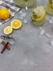 Lemon drink with lemon slices on a wooden background