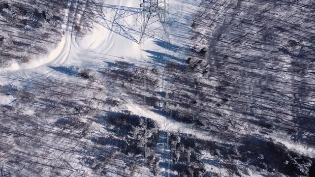 Interesting video for avid explorers featuring modern telecommunication towers with satellites and antennas, standing tall in a snow covered area.