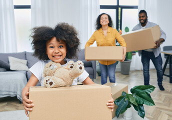 Happy African American family with cardboard boxes and things moves to a new home. Buying or renting a house for a young family - obrazy, fototapety, plakaty