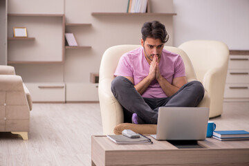 Young man working from home during pandemic