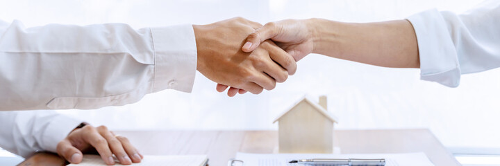 home loan insurance. .Real estate broker and client  sign contract insurance agreement document....