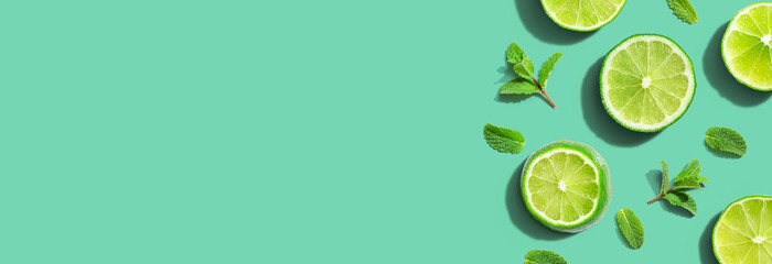 Fresh green limes with mints overhead view