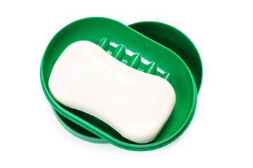 Travel soap in plastic soap dish isolated on white background