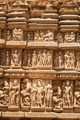 Erotic depictions, deity figures and busty 'Beautiful Girls' - all the figures at the Kandariya Mahadeva Temple are almost fully sculptured. Day. Normal Perspective. Khajuraho. India.