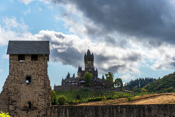 View on the castle in cochem surrounded by vineyards