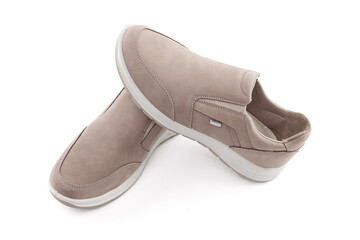 Pair of running shoes isolated in white background. Close-up of elegant gray shoes for adult man on white background.