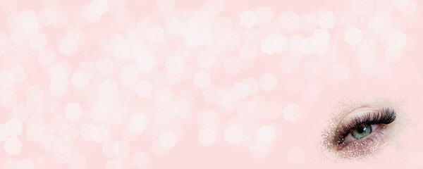 Pink banner with eyelash extensions for beauty salon copy space 