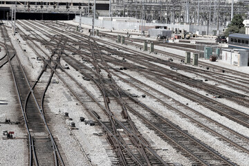Train tracks departing a railway station used for commuter traffic.