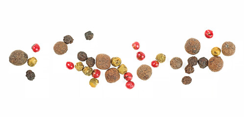 Heap of black, red, green and allspice peppercorns isolated on a white background. Top view of pepper mix.