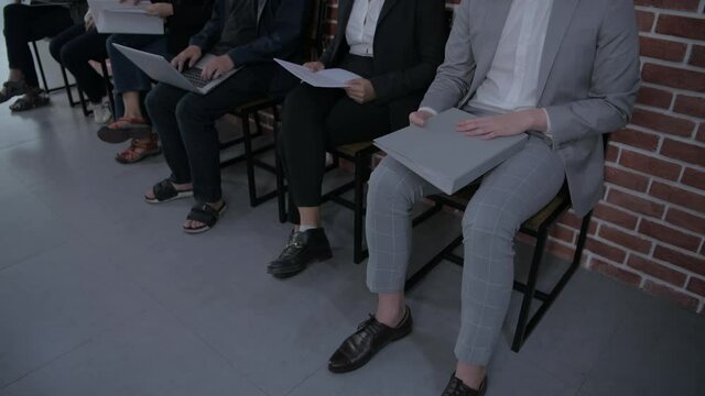 Business concept of 4k Resolution. Employees are concerned while waiting to apply for work in the office.