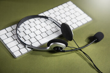 headphones on white keyboard