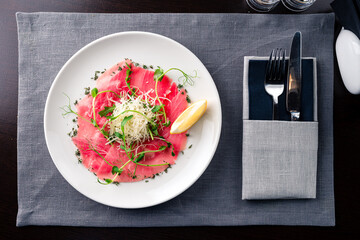 Tuna carpaccio on a plate