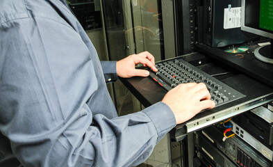 man working on computer servers