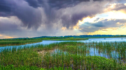 stormy sunset sky in Alabama swamp landscape in summer