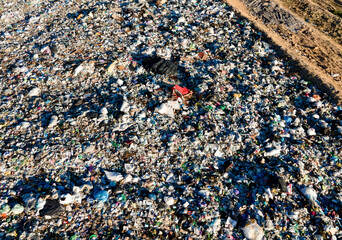 Garbage dump with plastic bags and food waste. Recycling of waste on junk yard. Dispose the rubbish in landfill. Trash disposal and rubbish dump with polution. Ecology, refuse and natural resources