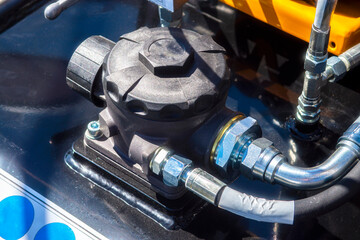 Close up of pipe system of hydraulic valves